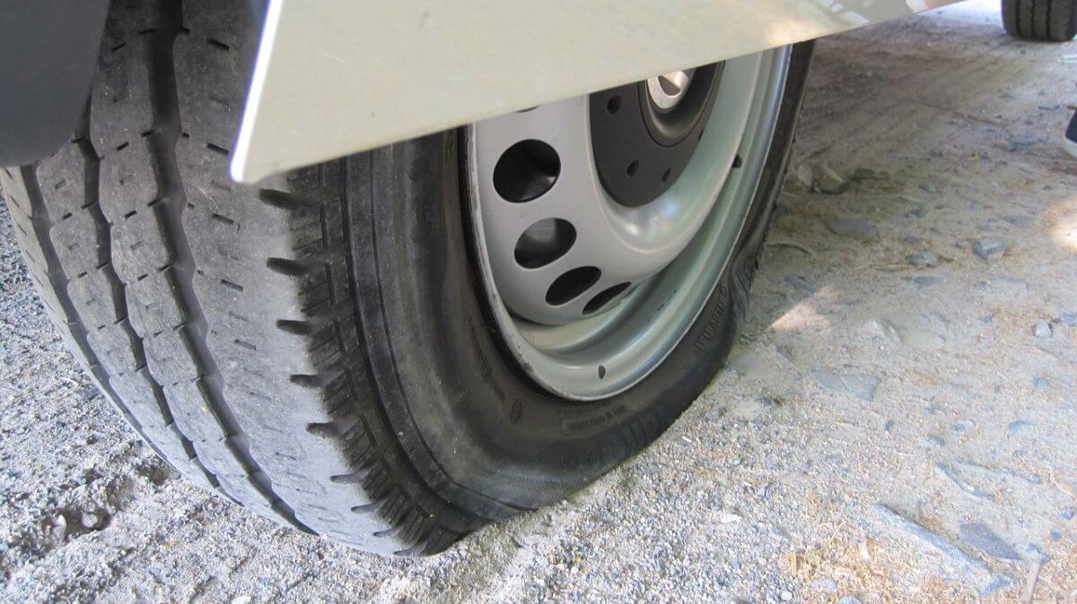 Car with popped tyre