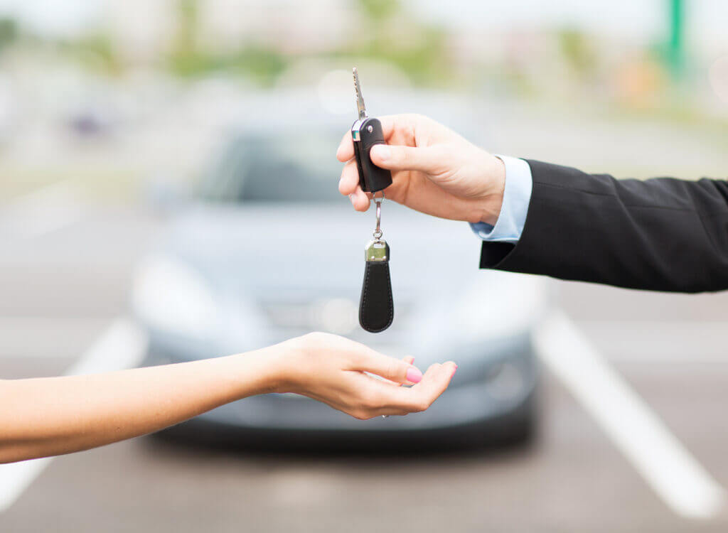 Man handing a woman car keys