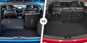 A side-by-side comparison of the boots of two cars. On the left is the boot of a Ford Focus, with the rear seats folded down to reveal a spacious cargo area. On the right is the boot of a Volkswagen Polo, with the rear seats folded down to reveal a smaller cargo area.