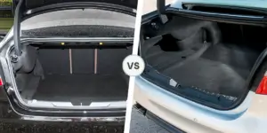 A side-by-side comparison of the boot of two Jaguar cars. The boot on the left is smaller and has a more cargo hooks and a narrow opening. The boot on the right is larger and has a wider opening.