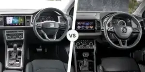 A comparison of the interiors of a SEAT Ateca and a Skoda Karoq. The left side shows the interior of the SEAT Ateca, featuring a black dashboard with a large touchscreen, a three-spoke steering wheel, and a gear shifter. The right side shows the interior of the Skoda Karoq, also with a black dashboard, a large touchscreen, a three-spoke steering wheel, and a gear shifter. The two interiors are separated by the word "VS. 