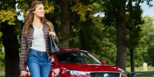 person walking in front of a car