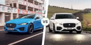 A side-by-side comparison of two Jaguar cars. The car on the left is blue and has a sportier design with larger wheels and a more aggressive front bumper. The car on the right is white and has a more elegant design with smaller wheels and a less aggressive front bumper.