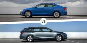 A side-by-side comparison of two Skoda cars. The car on the left is a blue sedan, and the car on the right is a gray estate (wagon) model. Both cars are parked on a concrete surface with a clear blue sky in the background.