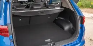 Cargo area of a Kia Sportage with the rear seats folded down.